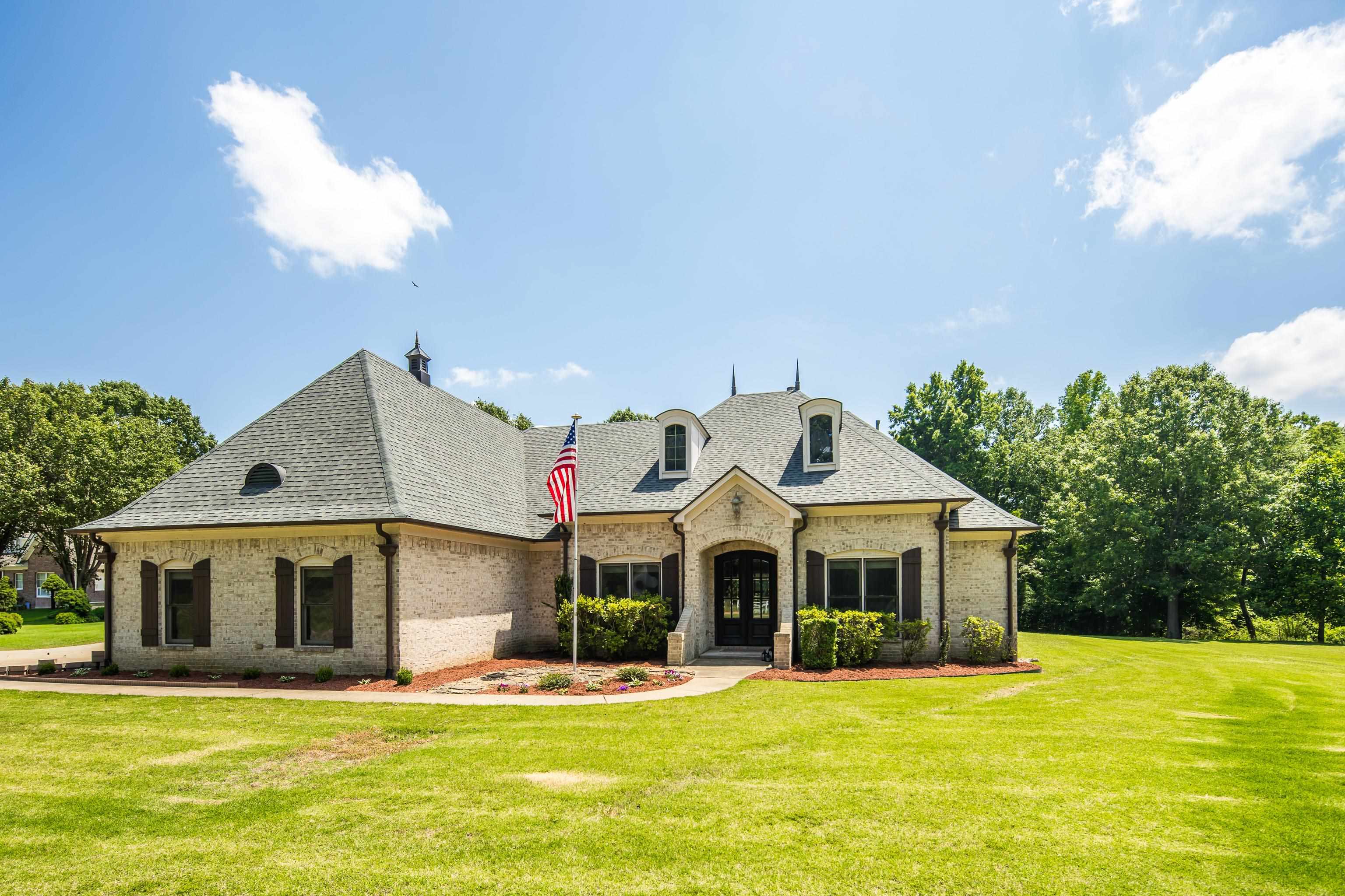 9028 Osborntown Road Arlington, TN 38002 - Photo 3 of 40 a front view of a house with a yard