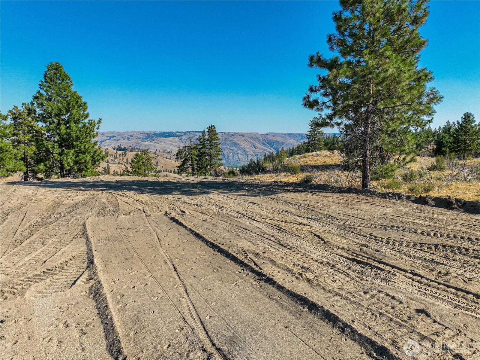0 Evergreen Camp Road Chelan, WA 98816 - Photo 7 of 21 a view of a yard with wooden fence