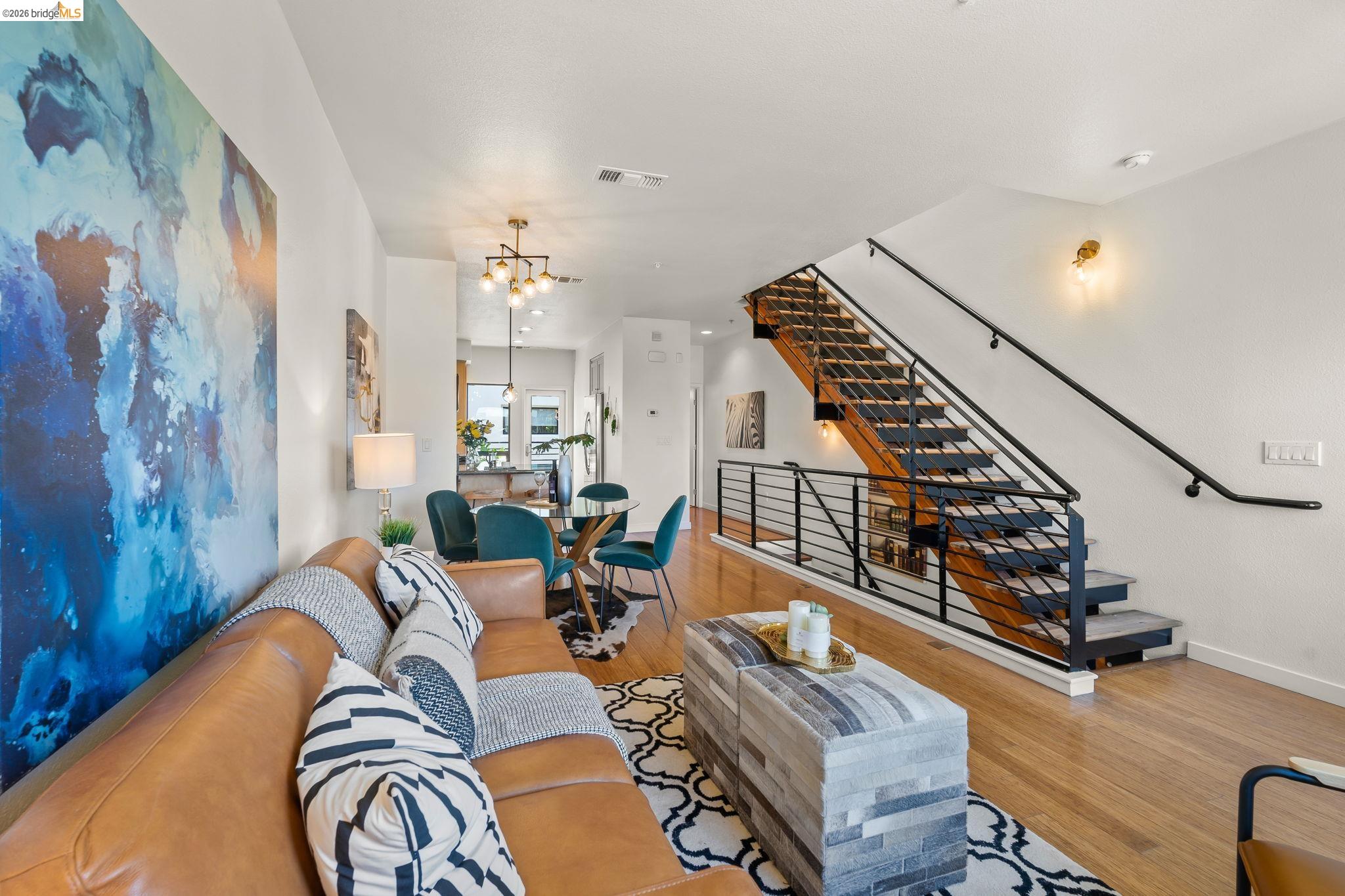 1780 12th Street Oakland, CA 94607 - Photo 13 of 31 a living room with furniture and wooden floor