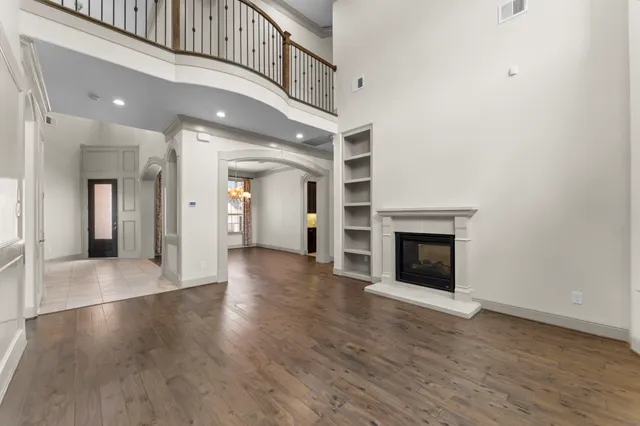a kitchen with granite countertop a sink a stove and cabinets