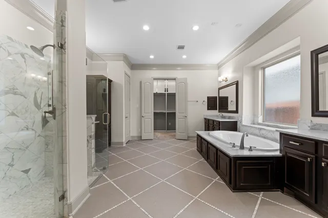 a bathroom with a bathtub sink and mirror