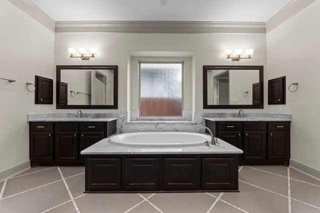 a kitchen with stainless steel appliances a refrigerator and cabinets