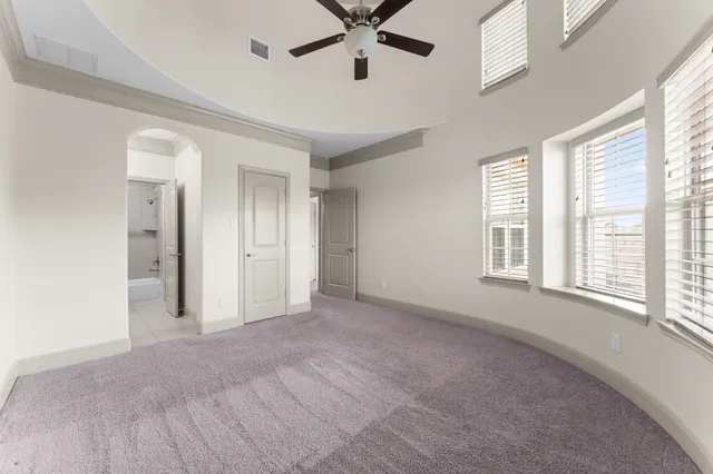 a bathroom with a granite countertop sink mirror and a bathtub