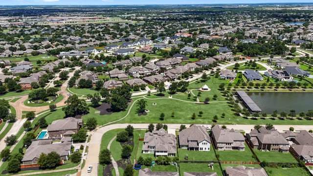 an aerial view of a house with a lake view