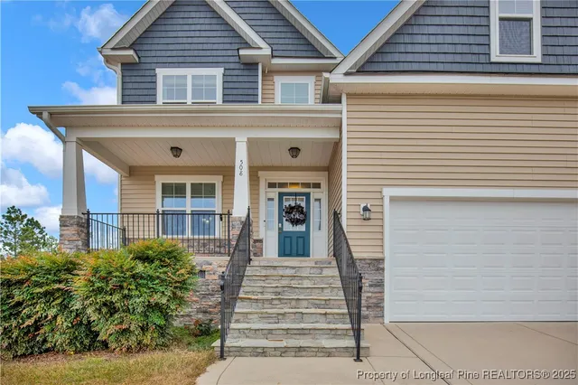 a view of a house with entrance and windows