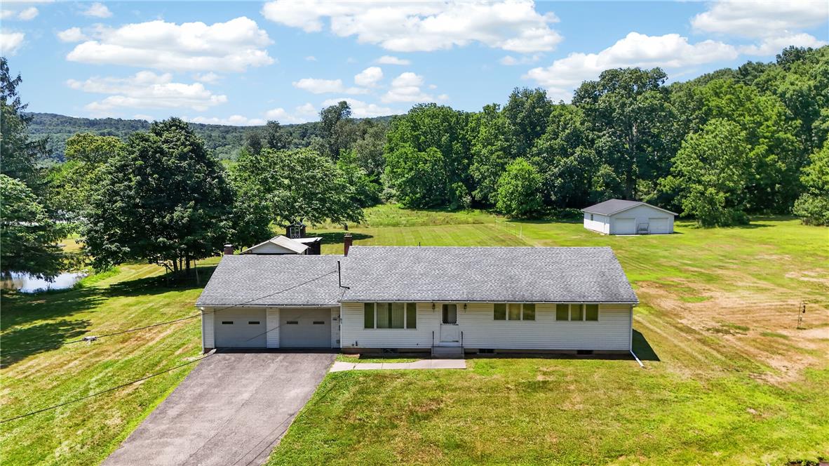 51 Reynolds Road Tamaqua, PA 18252 - Photo 55 of 71 A rural retreat featuring a comfortable home with a two-car garage, expansive green acreage, and a tranquil pond nearby.