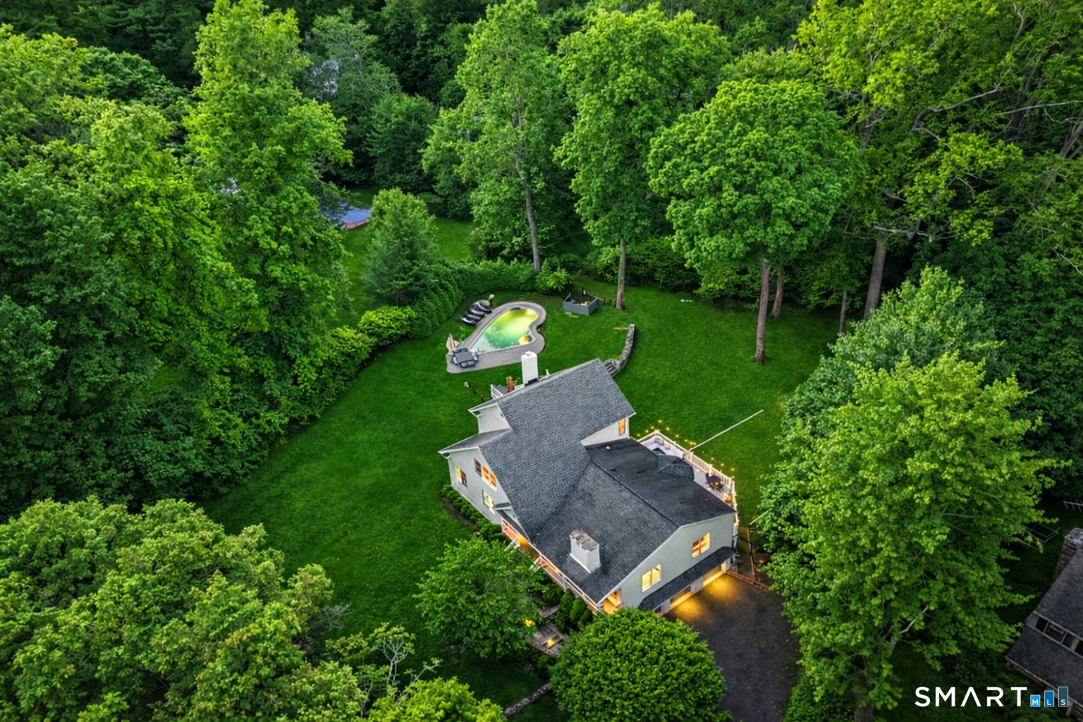 an aerial view of a house with outdoor space and street view