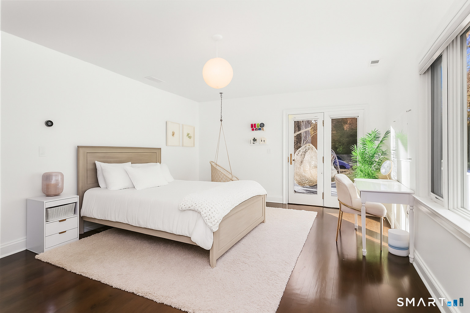1 Angora Road Westport, CT 06880 - Photo 20 of 39 a spacious bedroom with a bed and a chandelier