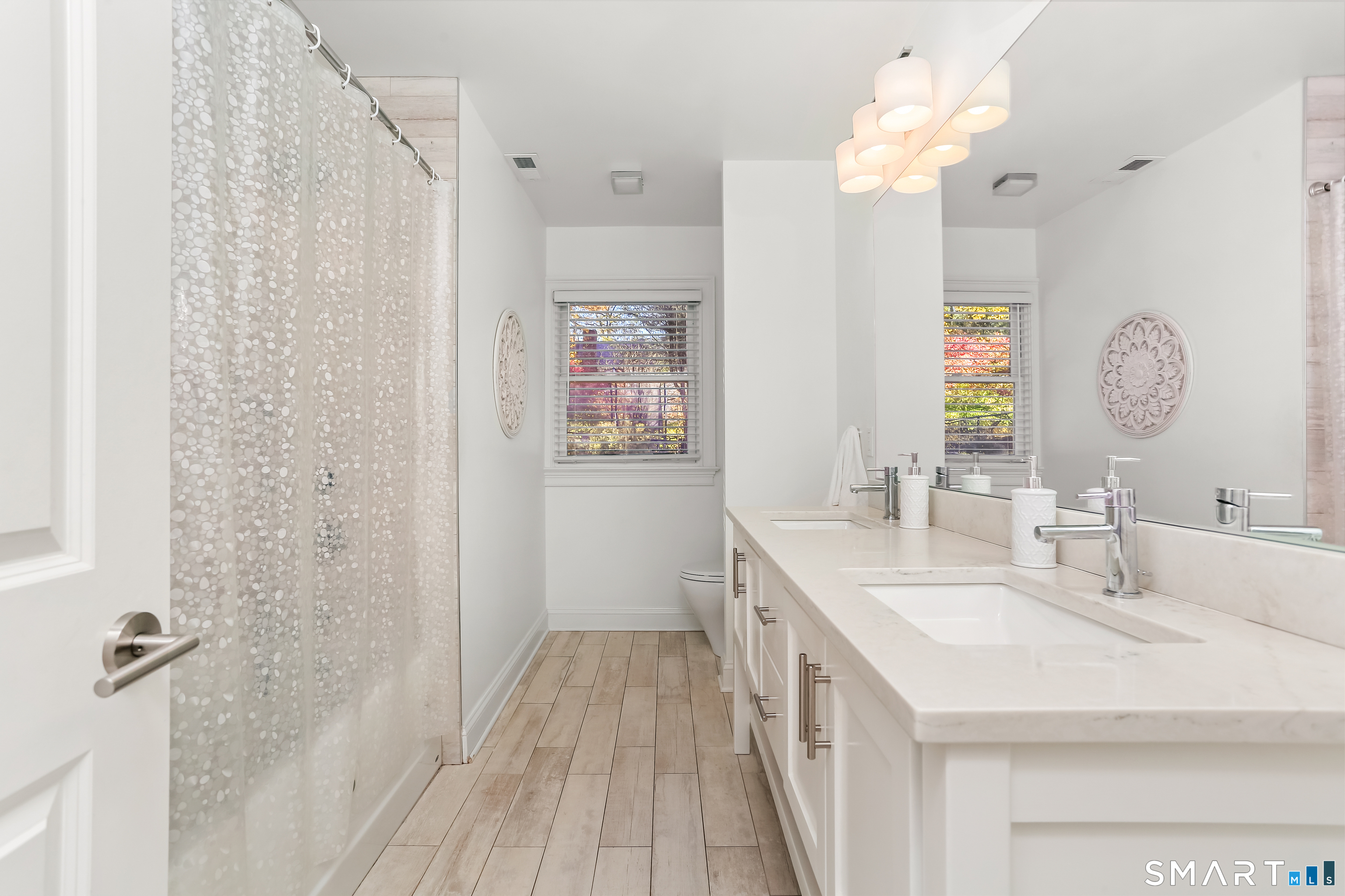 1 Angora Road Westport, CT 06880 - Photo 23 of 39 a bathroom with a sink a mirror and a shower