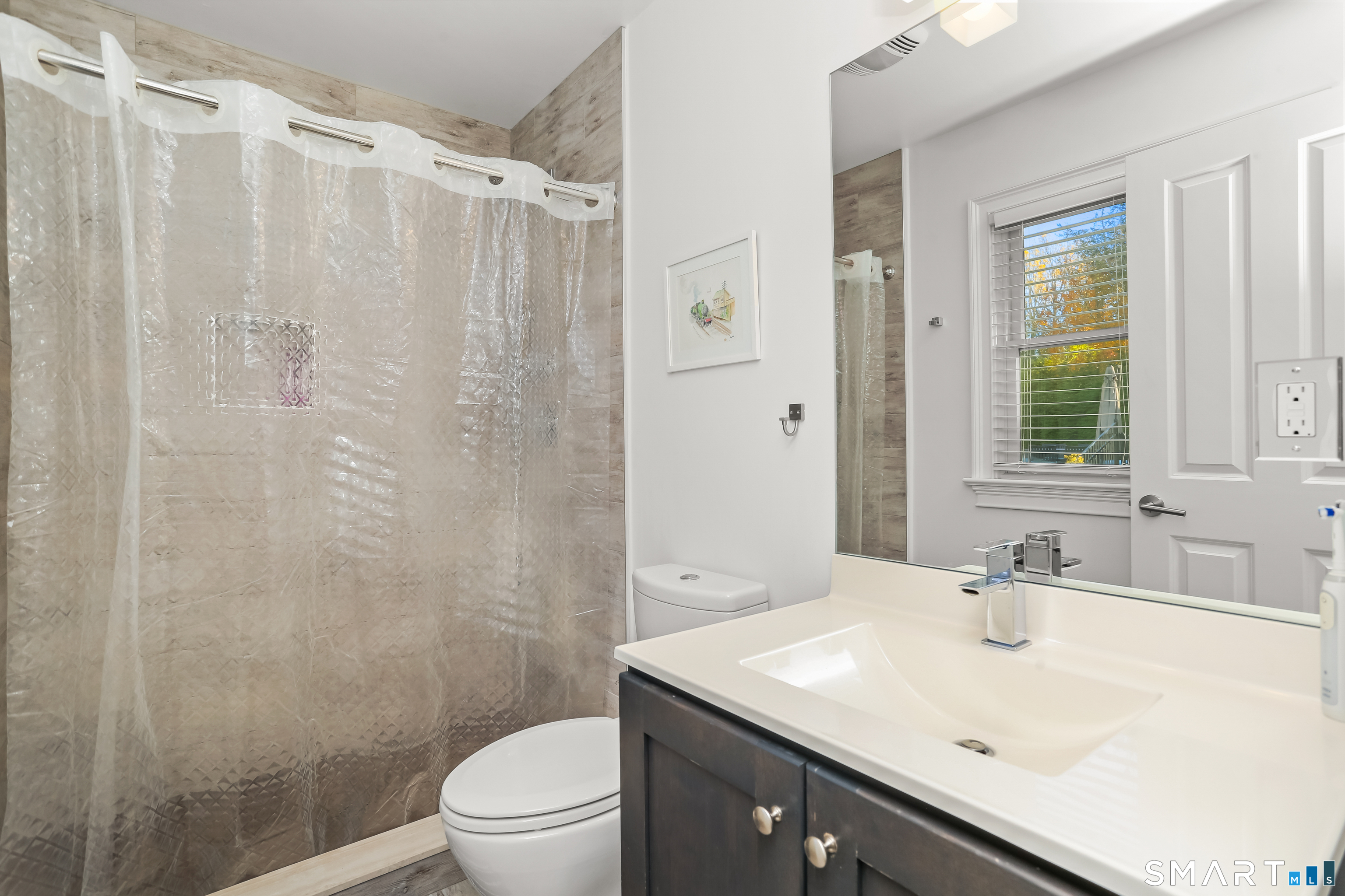 1 Angora Road Westport, CT 06880 - Photo 25 of 39 a bathroom with a sink a toilet and shower