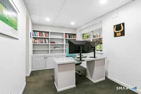 a view of a workspace with furniture
