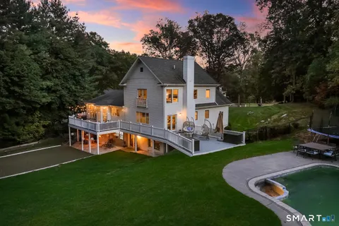 a view of a house with pool porch and chairs