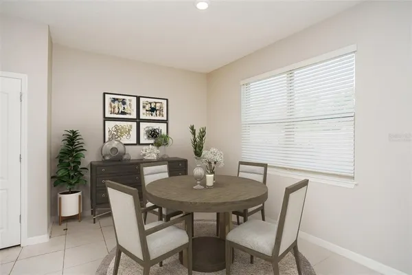 a view of a dining room with furniture and window