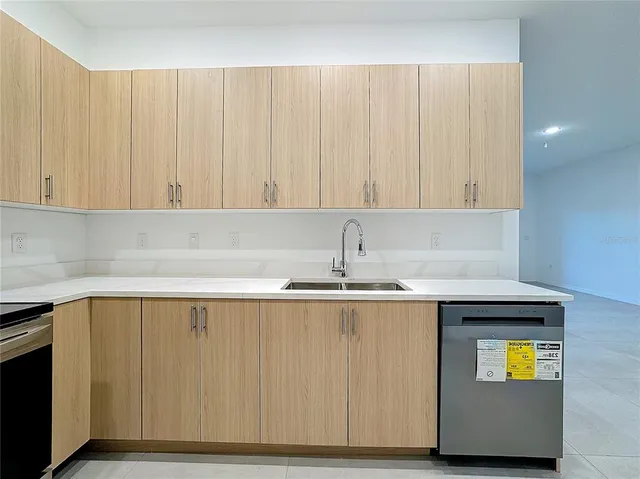 a kitchen with a sink and cabinets