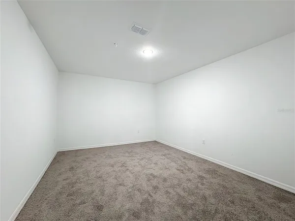 an empty room with a empty space and window