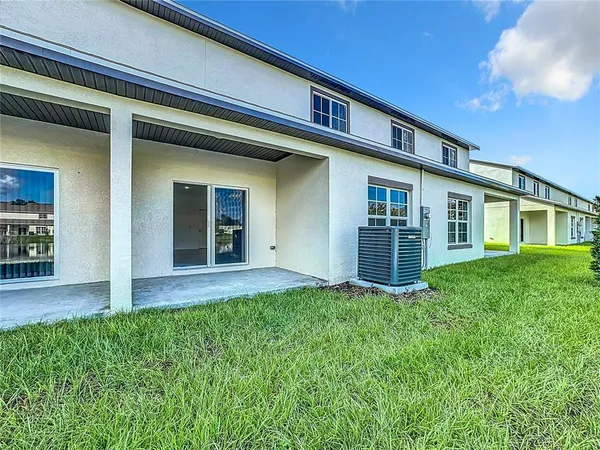 a house that has a big yard in front of it