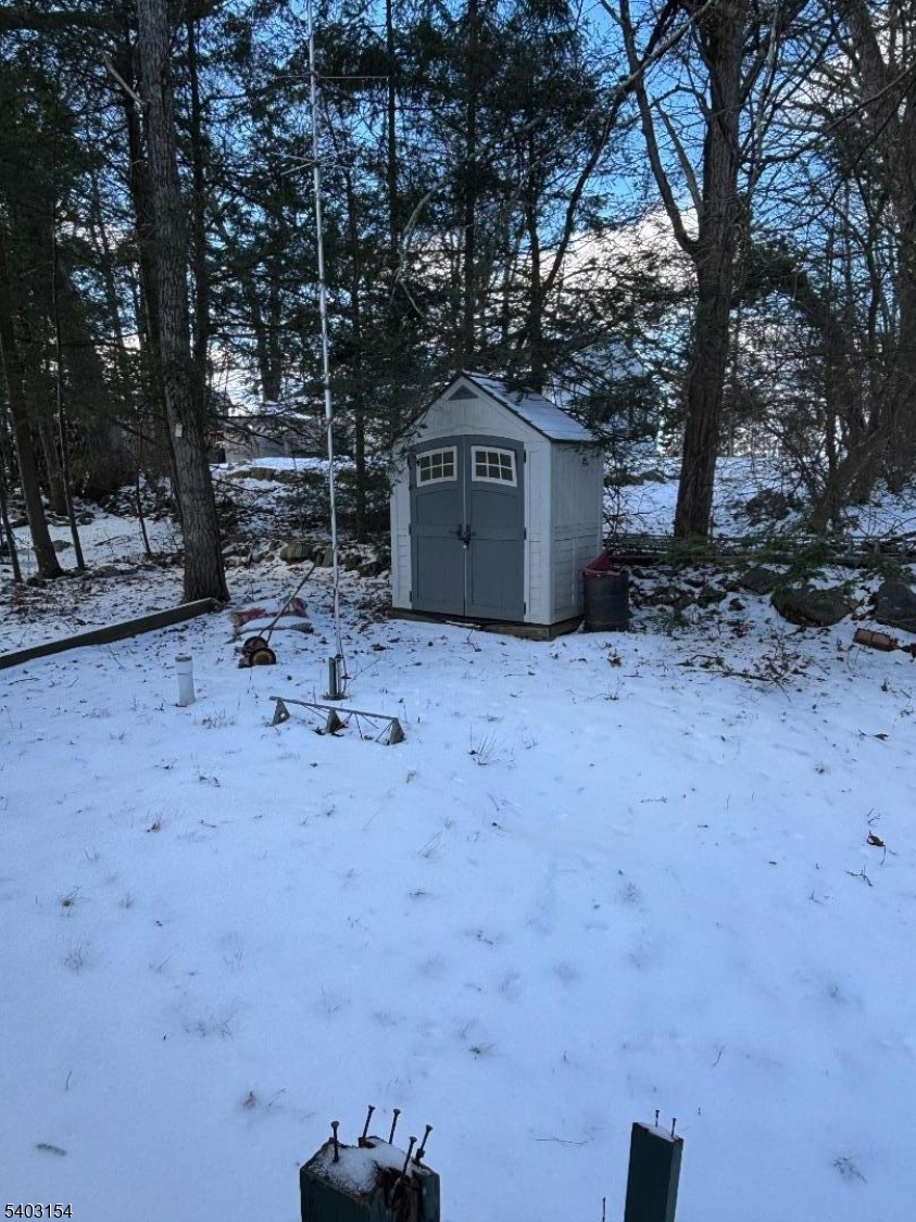 14 Mountain View Trail Wharton, NJ 07885 - Photo 14 of 14 a backyard of a house with a tree and wooden fence