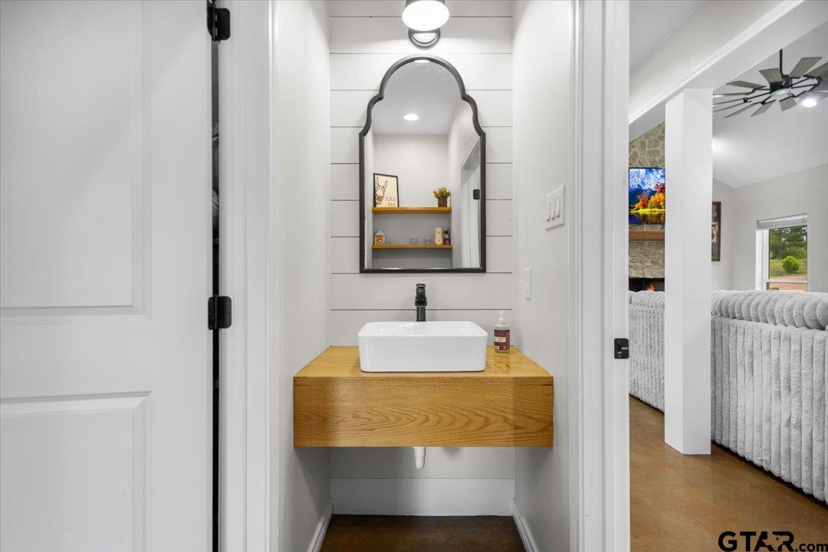 9235 Farm To Market Road 851 Rusk, TX 75785 - Photo 26 of 47 a bathroom with a sink and a mirror