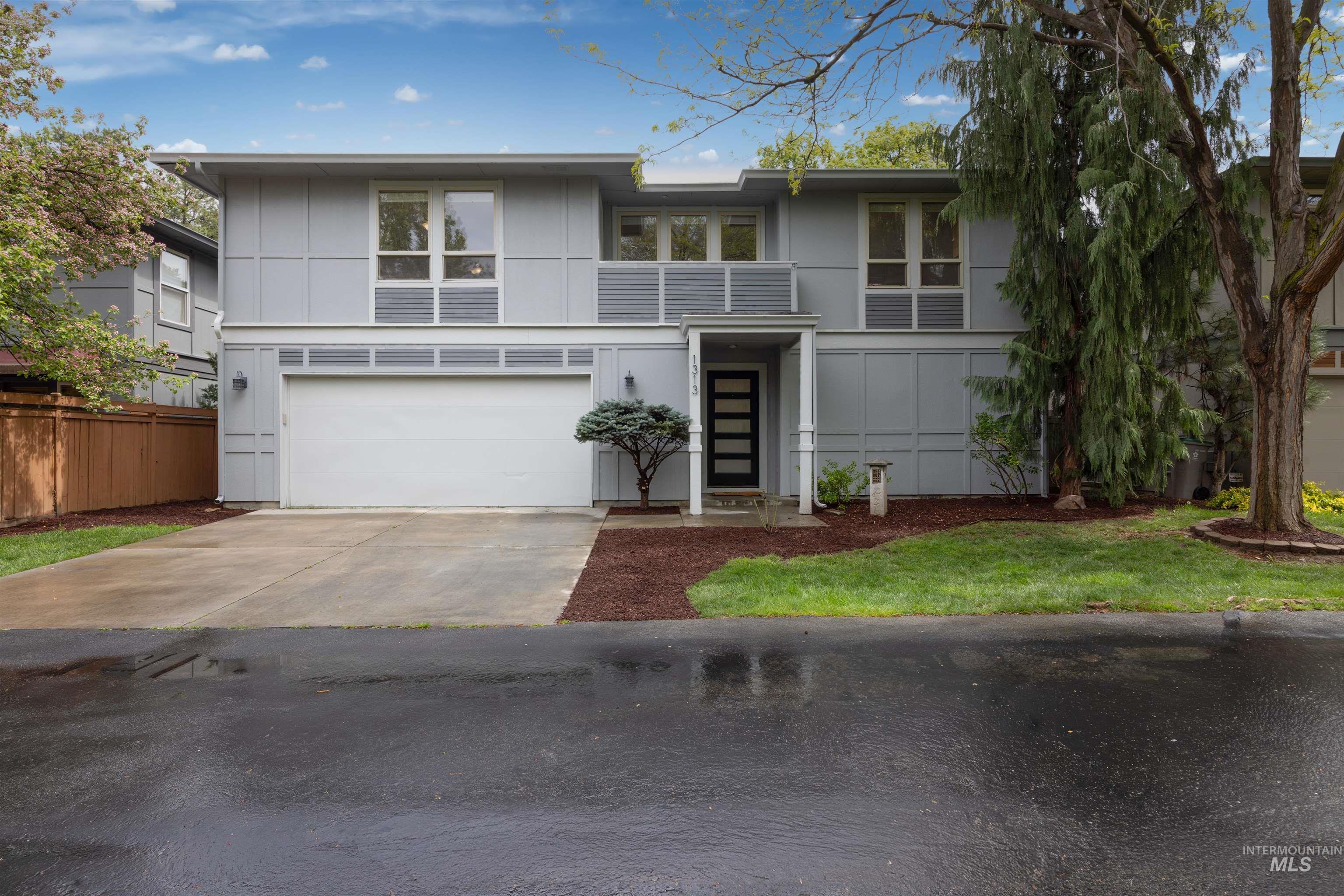 1313 Martin Street Boise, ID 83706 - Photo 19 of 46 Modern home featuring concrete driveway and an attached garage