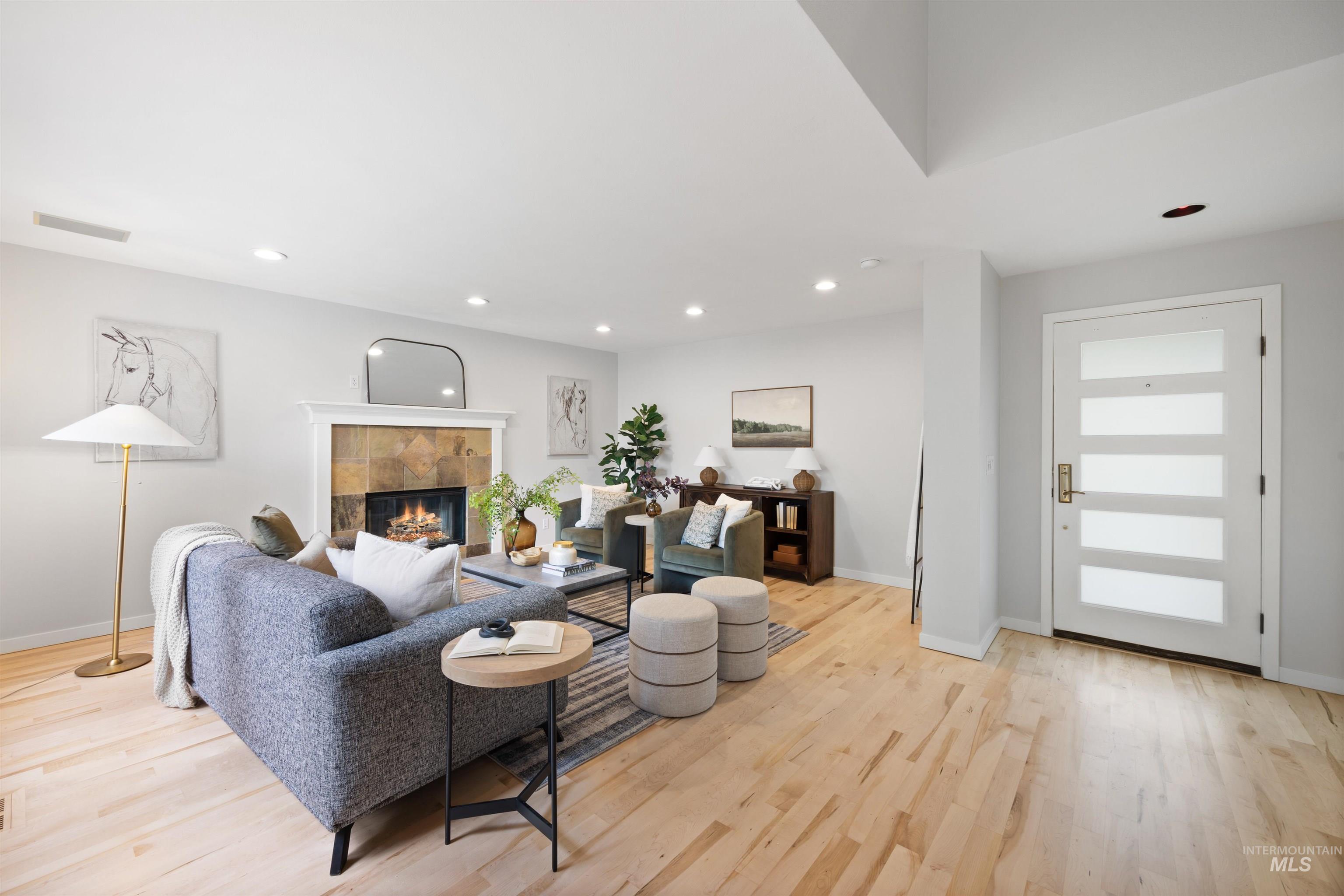 1313 Martin Street Boise, ID 83706 - Photo 20 of 46 Living room with light wood-style floors, recessed lighting, and a tiled fireplace