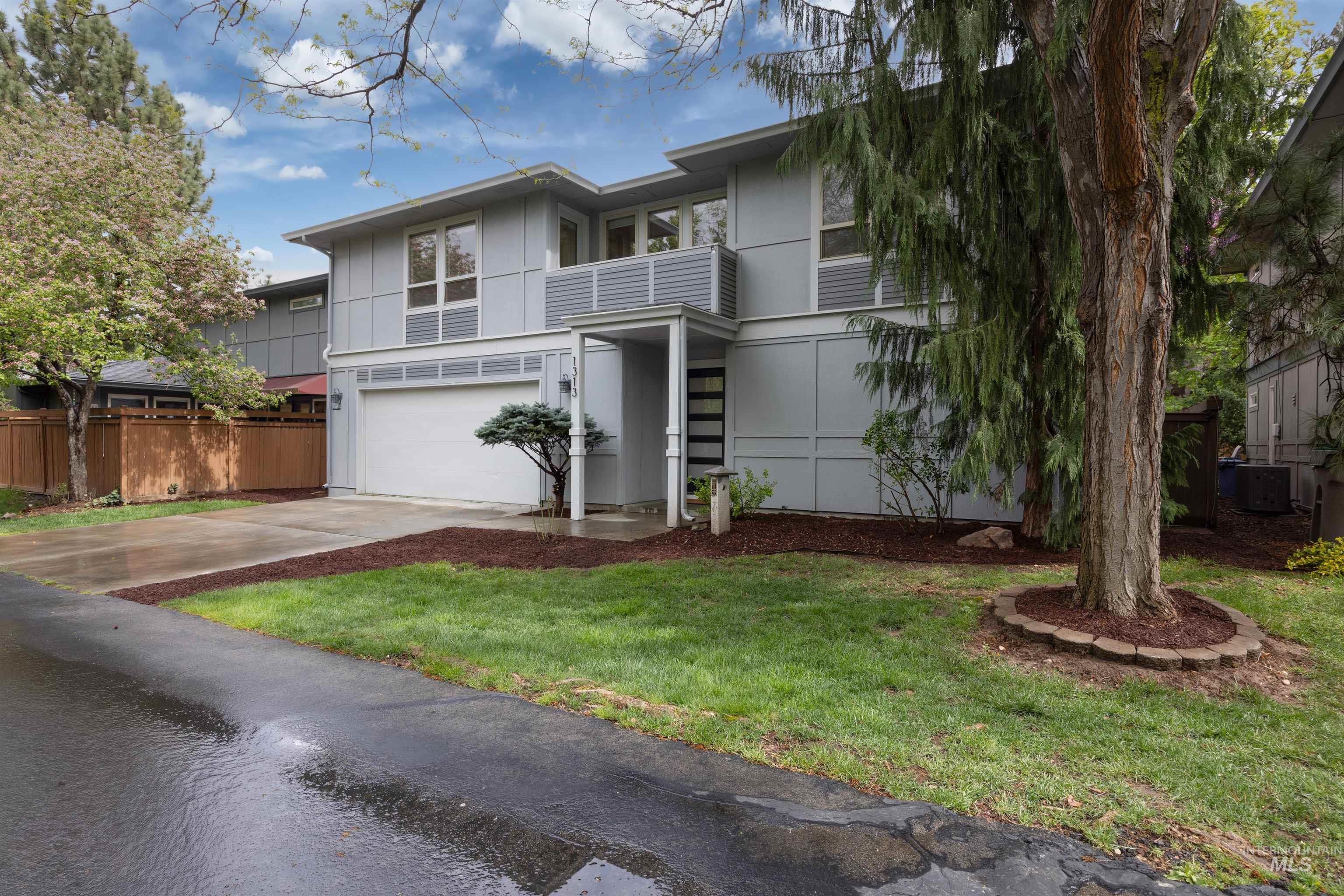 1313 Martin Street Boise, ID 83706 - Photo 2 of 46 View of front of house with concrete driveway and a garage