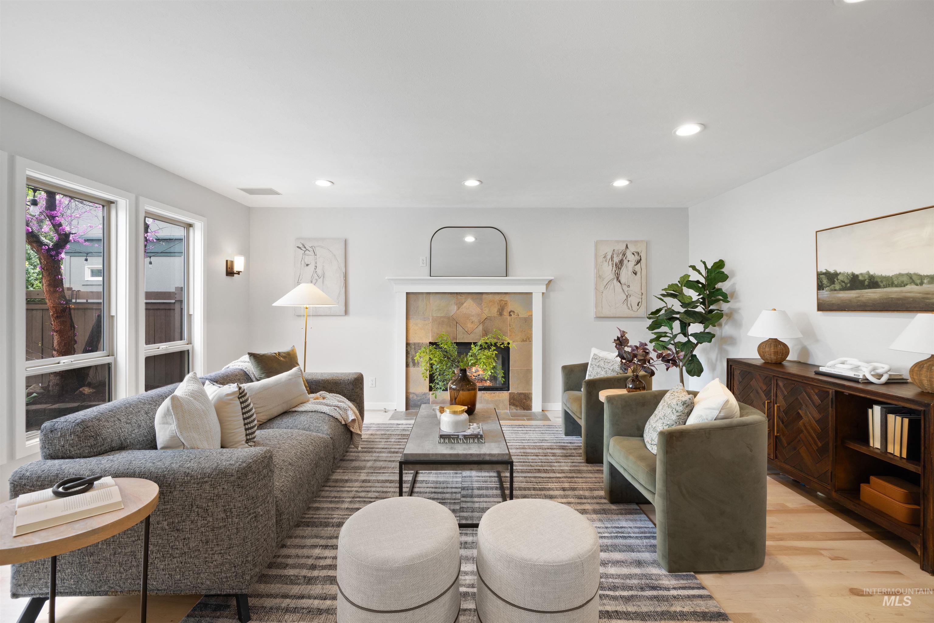 1313 Martin Street Boise, ID 83706 - Photo 21 of 46 Living room with recessed lighting, a tiled fireplace, and light wood-style floors