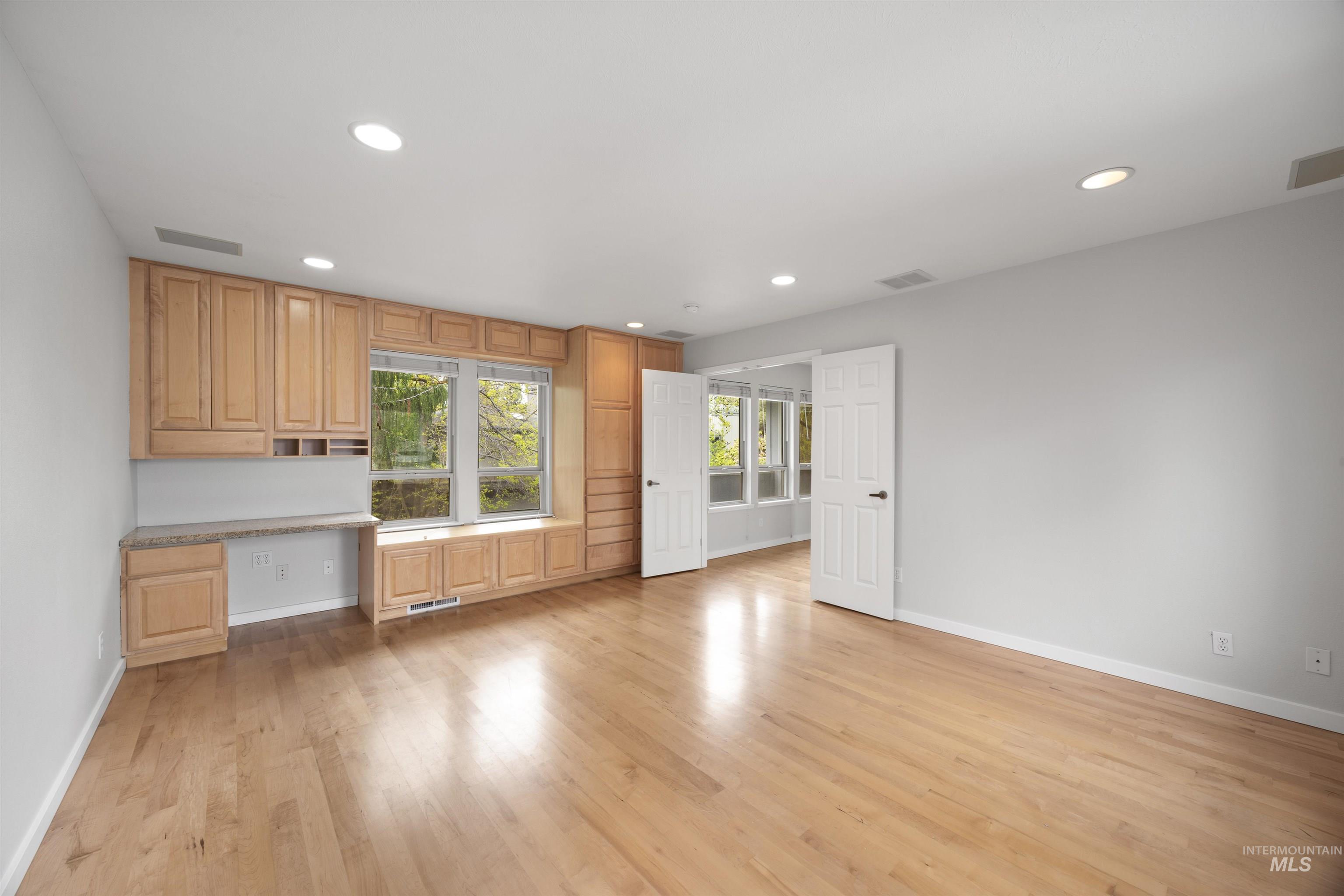 1313 Martin Street Boise, ID 83706 - Photo 34 of 46 Interior space with built in study area, light wood-style floors, and recessed lighting