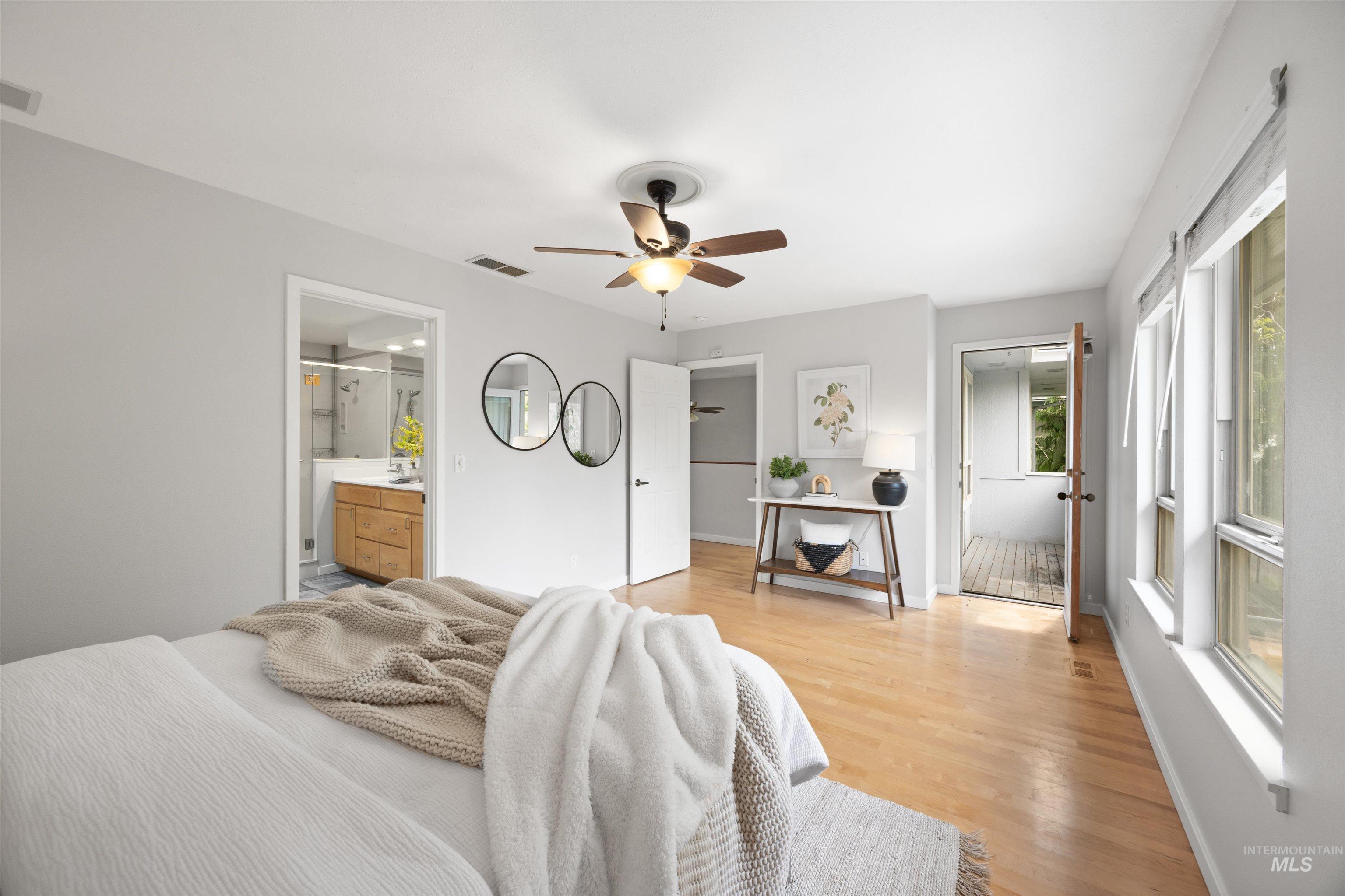 1313 Martin Street Boise, ID 83706 - Photo 38 of 46 Bedroom with light wood-style flooring, ceiling fan, and ensuite bathroom