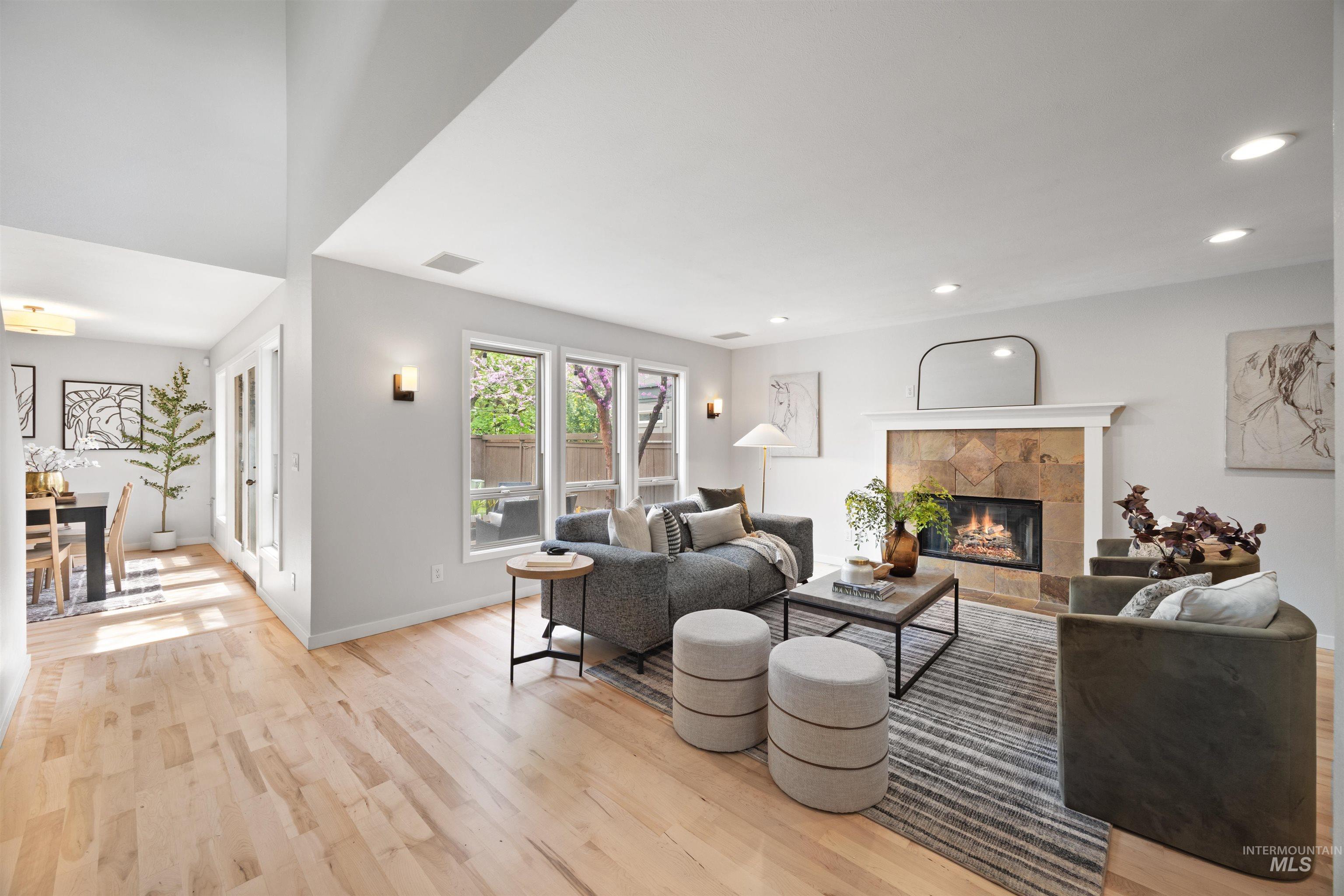 1313 Martin Street Boise, ID 83706 - Photo 4 of 46 Living area featuring light wood-style floors, a tiled fireplace, and recessed lighting
