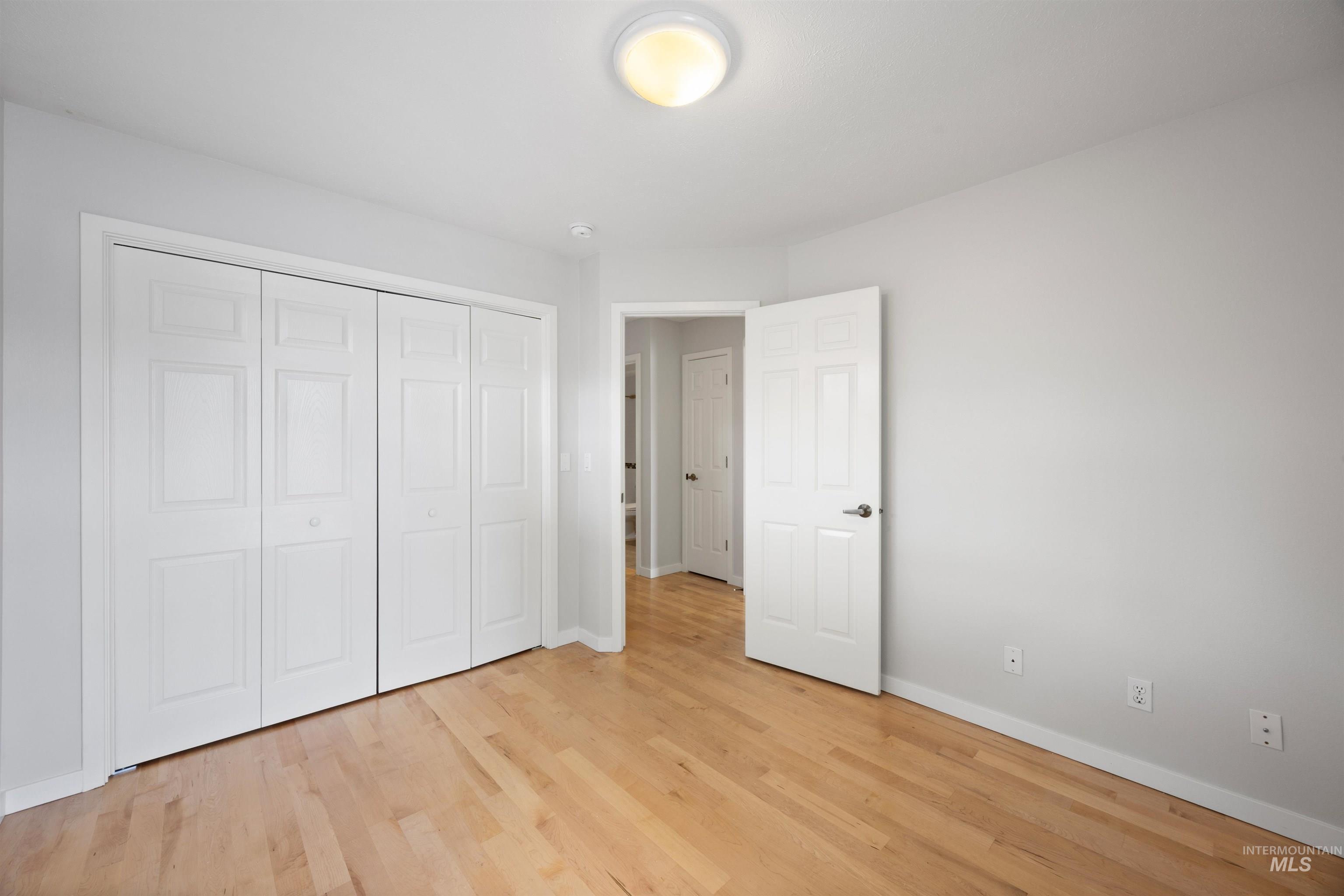 1313 Martin Street Boise, ID 83706 - Photo 43 of 46 Unfurnished bedroom with light wood-style flooring and a closet