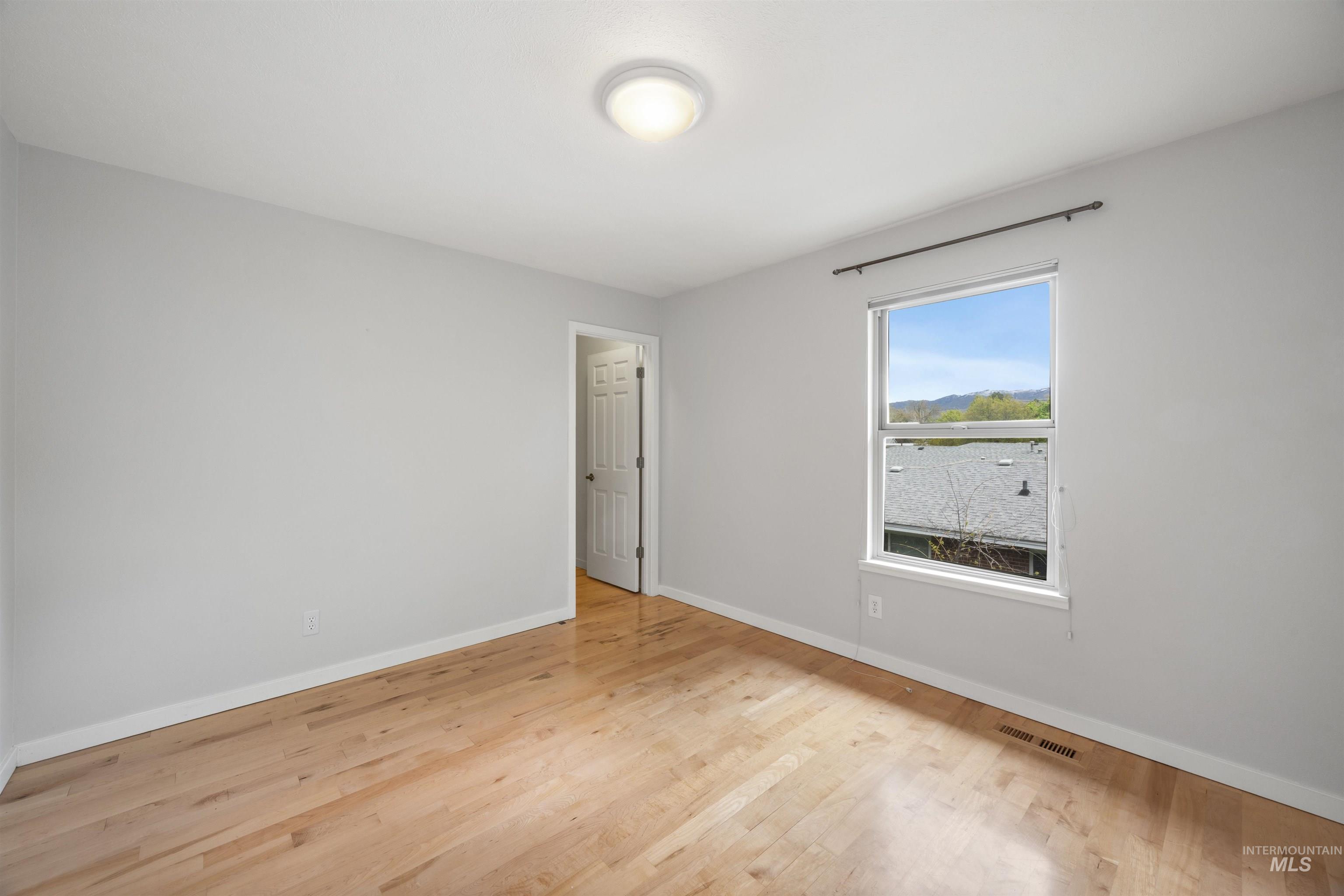 1313 Martin Street Boise, ID 83706 - Photo 44 of 46 Unfurnished bedroom featuring light wood finished floors