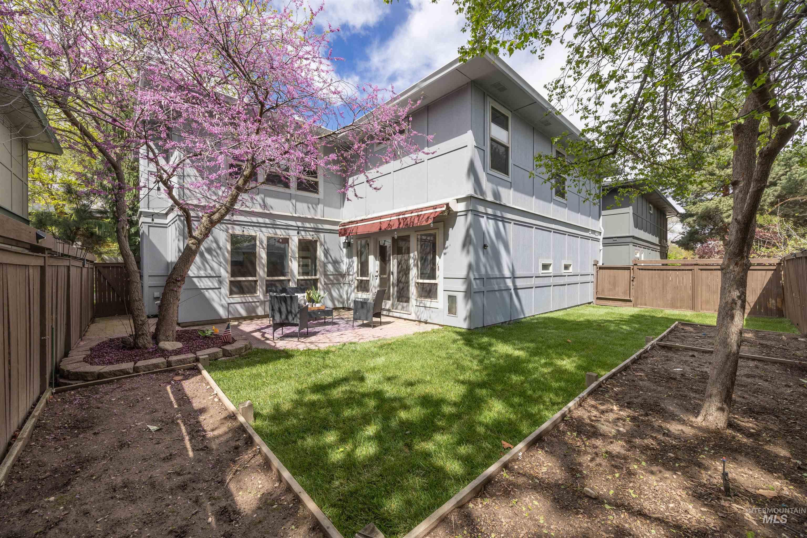 1313 Martin Street Boise, ID 83706 - Photo 9 of 46 Back of house featuring a fenced backyard and a patio