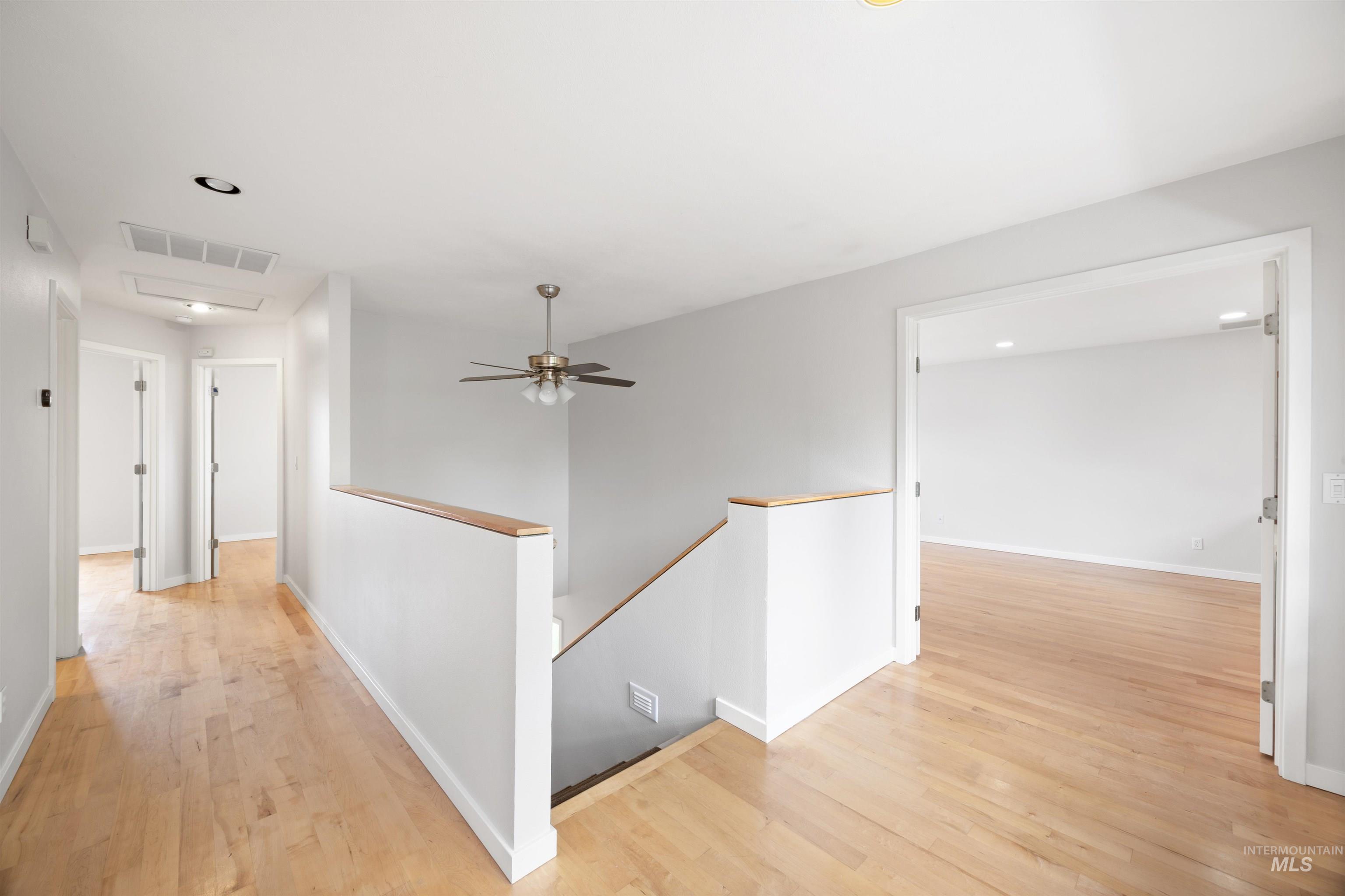 1313 Martin Street Boise, ID 83706 - Photo 10 of 46 Hallway featuring an upstairs landing, light wood finished floors, and recessed lighting