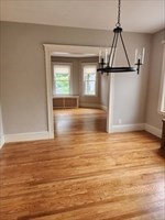 34 Averton Street, Unit 1 Boston, MA 02131 - Photo 4 of 16 a view of a room with wooden floor and window
