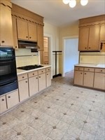34 Averton Street, Unit 1 Boston, MA 02131 - Photo 7 of 16 a kitchen with stainless steel appliances granite countertop a stove a sink and a microwave