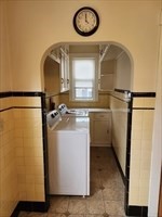 34 Averton Street, Unit 1 Boston, MA 02131 - Photo 8 of 16 a utility room with a sink a washer and dryer