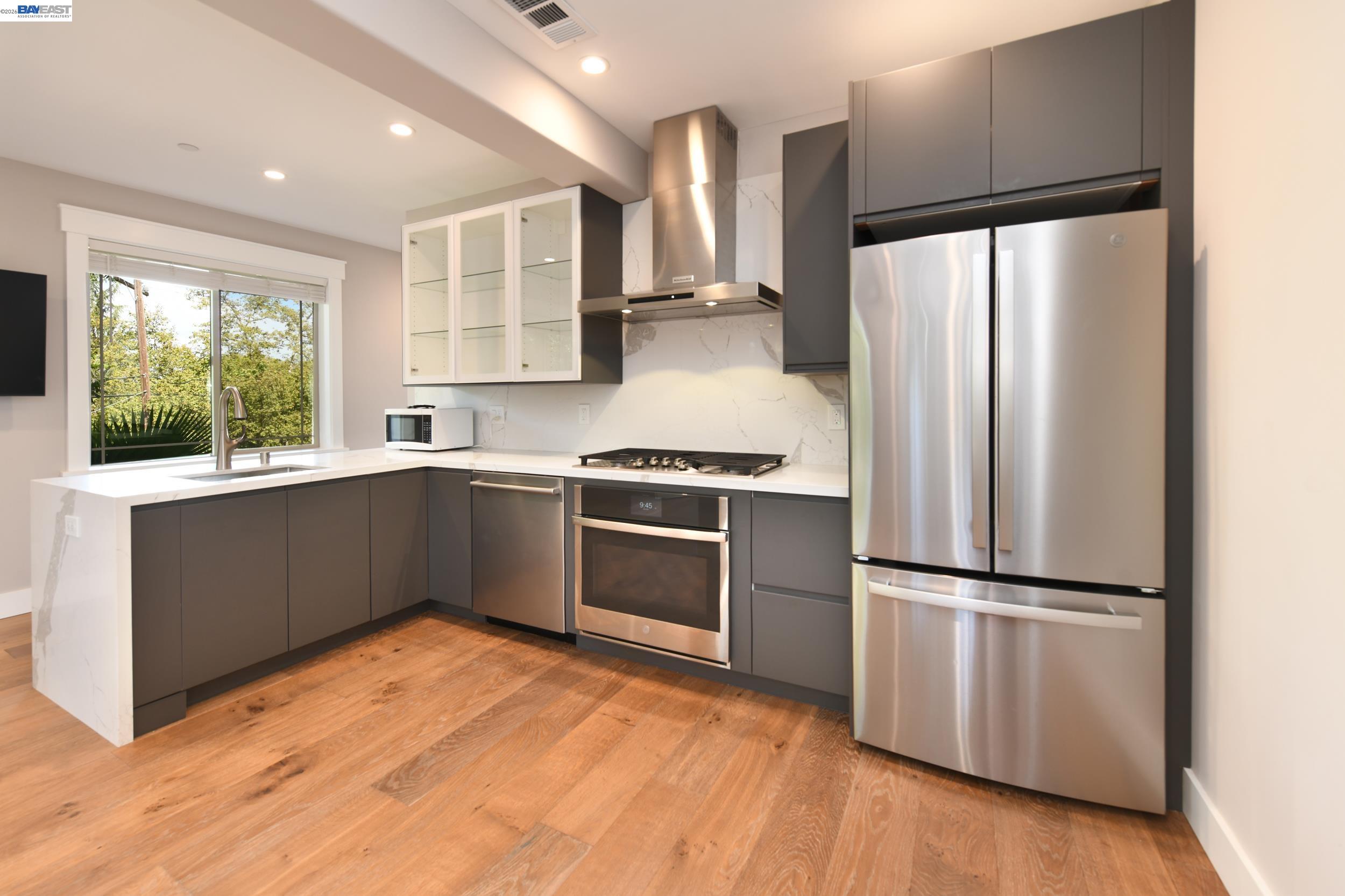 1516 Pleasant Hill Road Lafayette, CA 94549 - Photo 21 of 38 a kitchen with stainless steel appliances a refrigerator and a sink