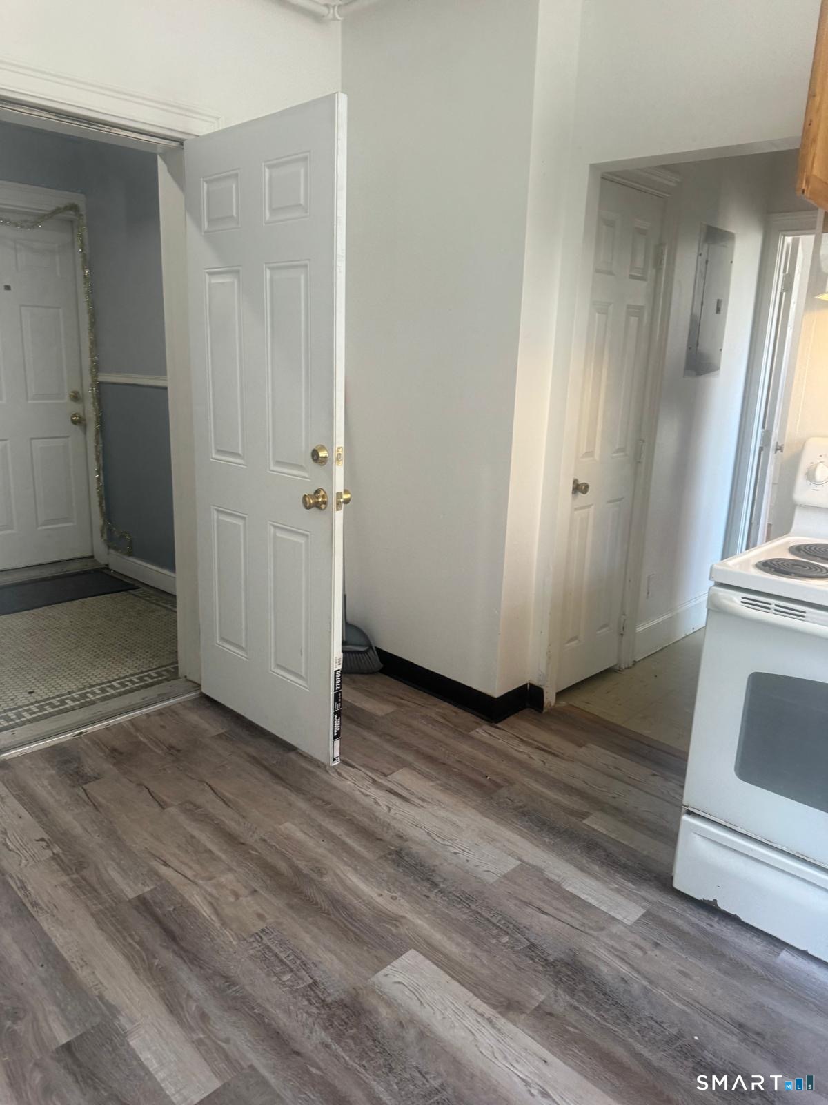 240 William Street, Unit 2B Bridgeport, CT 06608 - Photo 1 of 2 an empty room with wooden floor and entrance