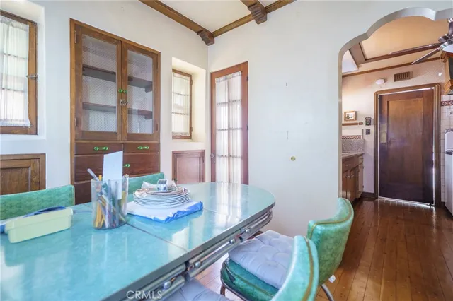 a view of kitchen with furniture and wooden floor