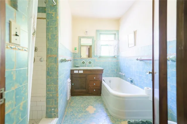 a bathroom with a bathtub and a sink