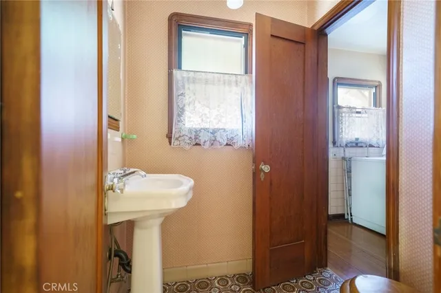 a bathroom with a sink a mirror and shower