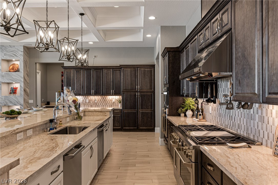 10118 Copper Edge Road Las Vegas, NV 89148 - Photo 9 of 48 A well-appointed kitchen showcasing elegant pendant lighting and a spacious island.