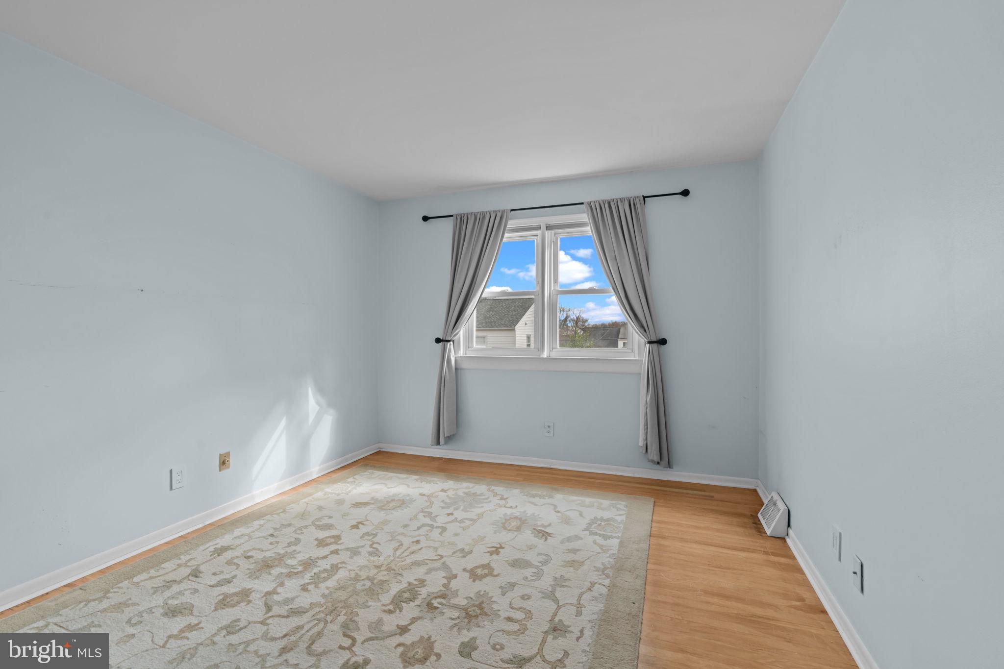 13039 Stevens Road Philadelphia, PA 19116 - Photo 13 of 32 wooden floor in an empty room with a window