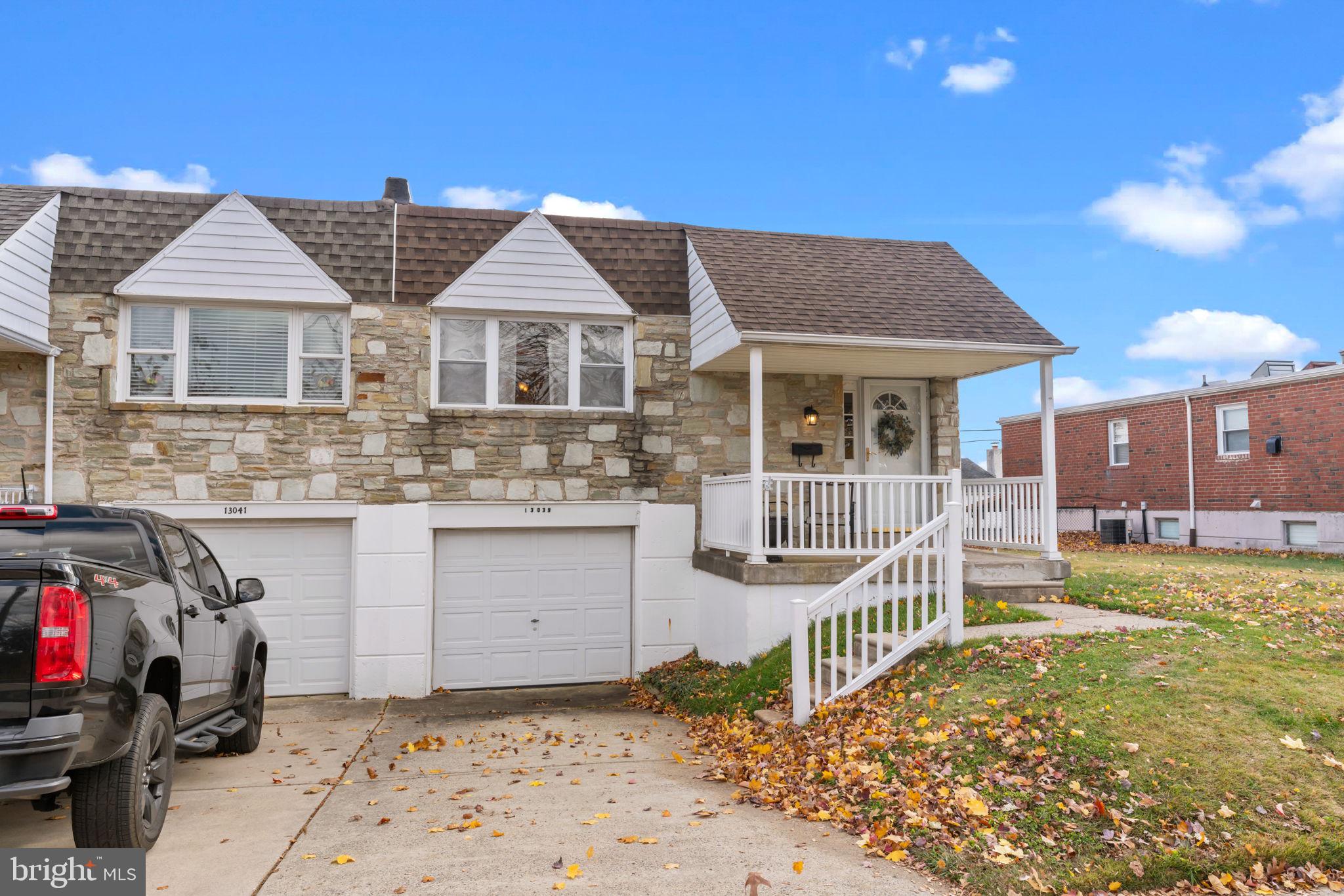 13039 Stevens Road Philadelphia, PA 19116 - Photo 25 of 32 a front view of a house with a yard