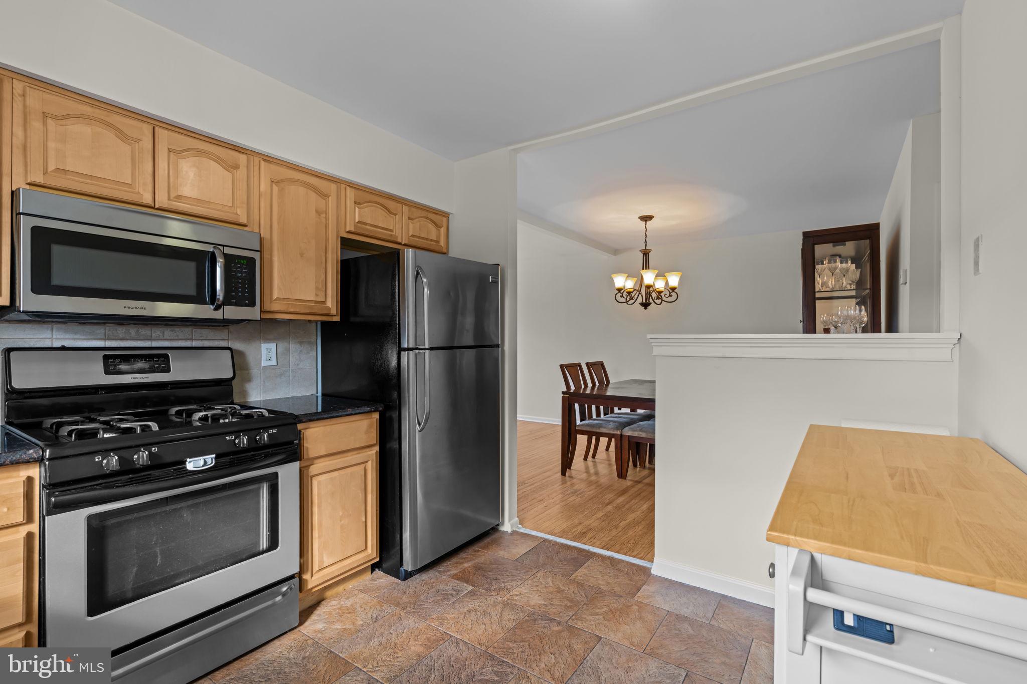 13039 Stevens Road Philadelphia, PA 19116 - Photo 9 of 32 a kitchen with a refrigerator stove and microwave