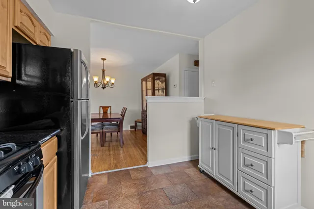 a view of living room kitchen with furniture and flat screen tv