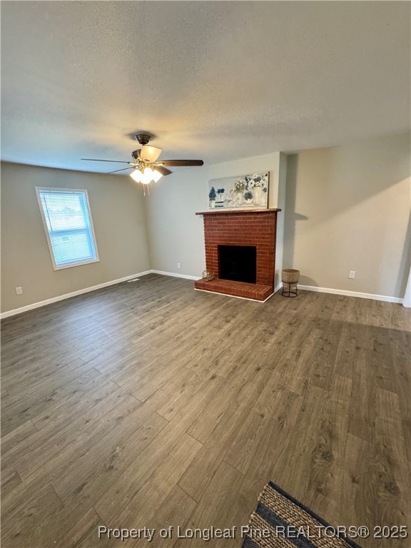 1283 Bethel Baptist Road Spring Lake, NC 28390 - Photo 17 of 44 wooden floor fireplace and windows in an empty room