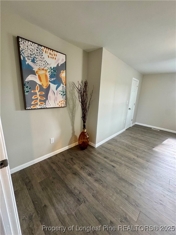 1283 Bethel Baptist Road Spring Lake, NC 28390 - Photo 19 of 44 an empty room with wooden floor and window