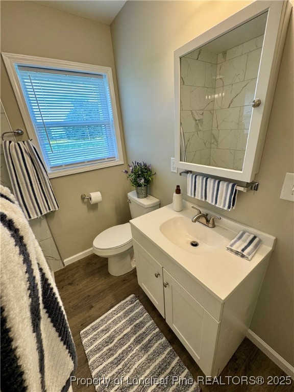 1283 Bethel Baptist Road Spring Lake, NC 28390 - Photo 21 of 44 a bathroom with a sink mirror toilet and next to a window