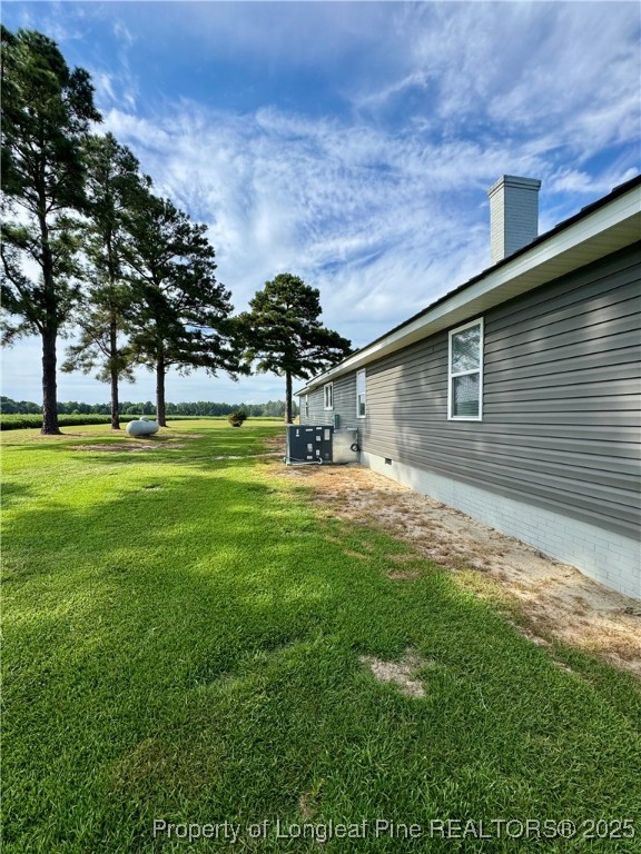 1283 Bethel Baptist Road Spring Lake, NC 28390 - Photo 33 of 44 a front view of a house with garden